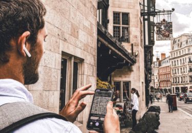 Person on their phone for a self-guided tour