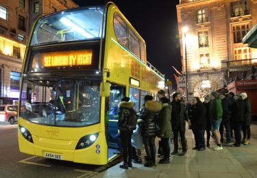 People boarding a London tour bus