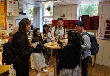 Group standing around a pub style round table