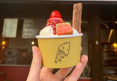 Cup of ice cream with a cherry on top