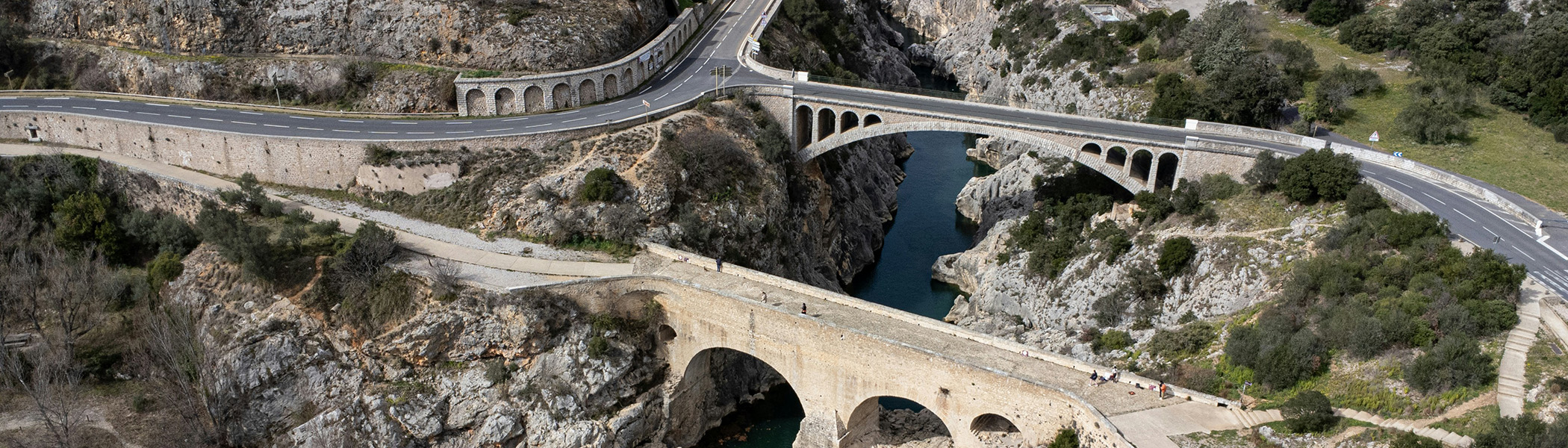 Aerial view of a bridge over the Herault River in Pont du Diable, France.